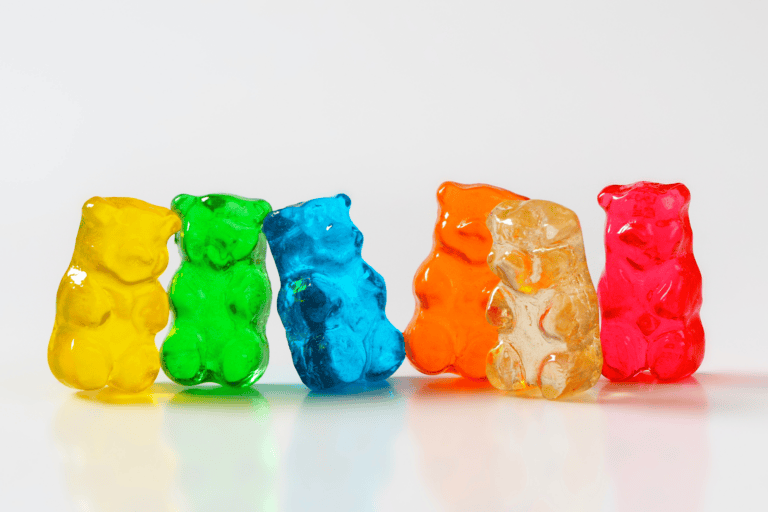 Gummy bears in various colors lined up
