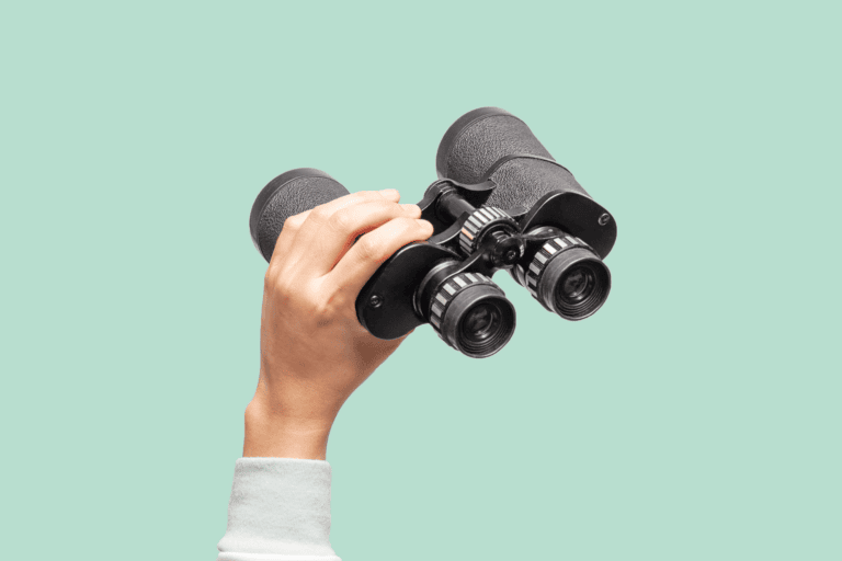 man holding binoculars