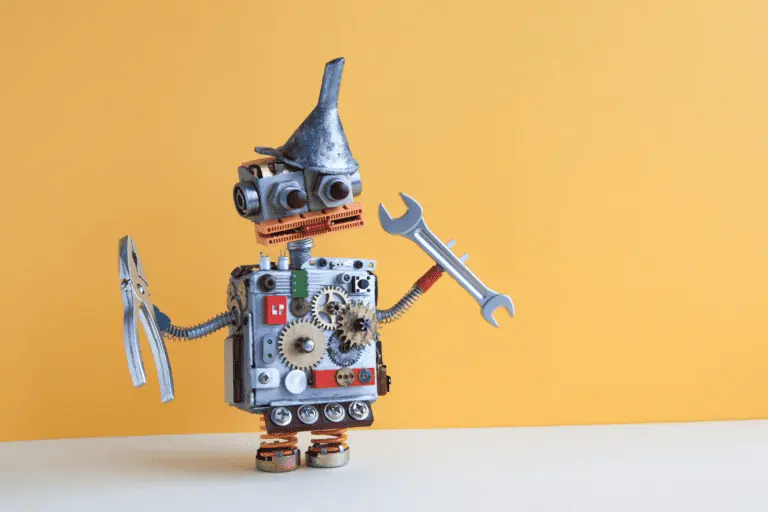 tin maintenance robot made of gears holding wrench and pliers