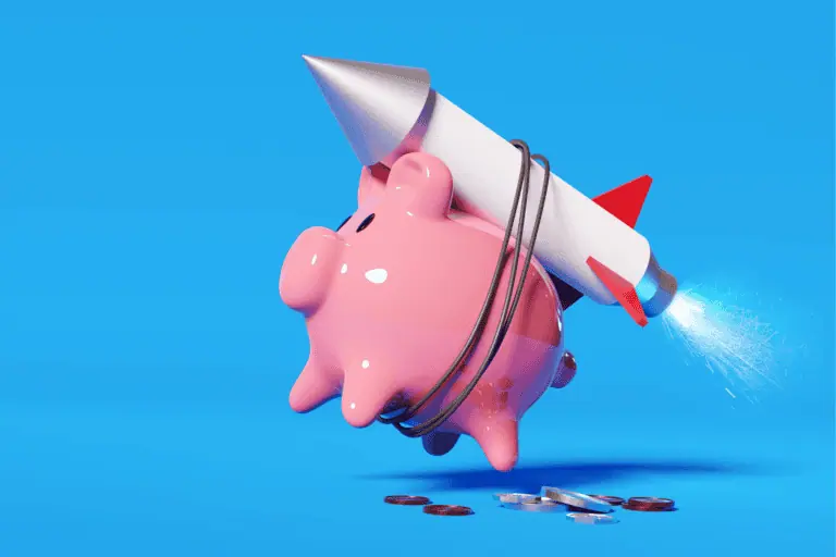 piggy bank with coins and rocket on blue background
