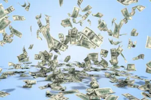 Are you wasting your online marketing budget. Money flying in the air on blue background