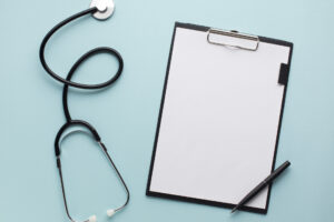 year-end marketing review, clipboard and stethoscope