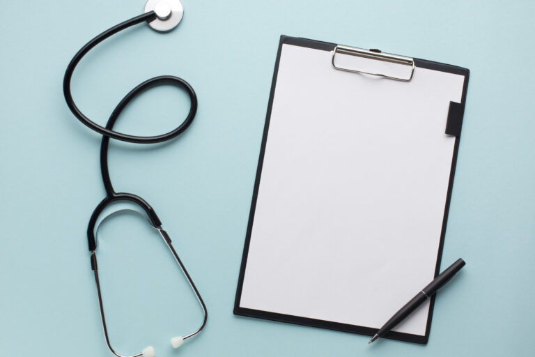year-end marketing review, clipboard and stethoscope