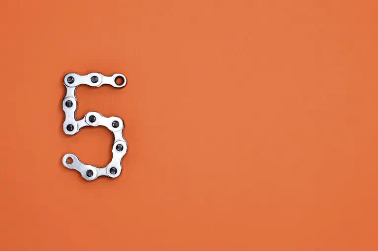 metal letter 5 on orange background