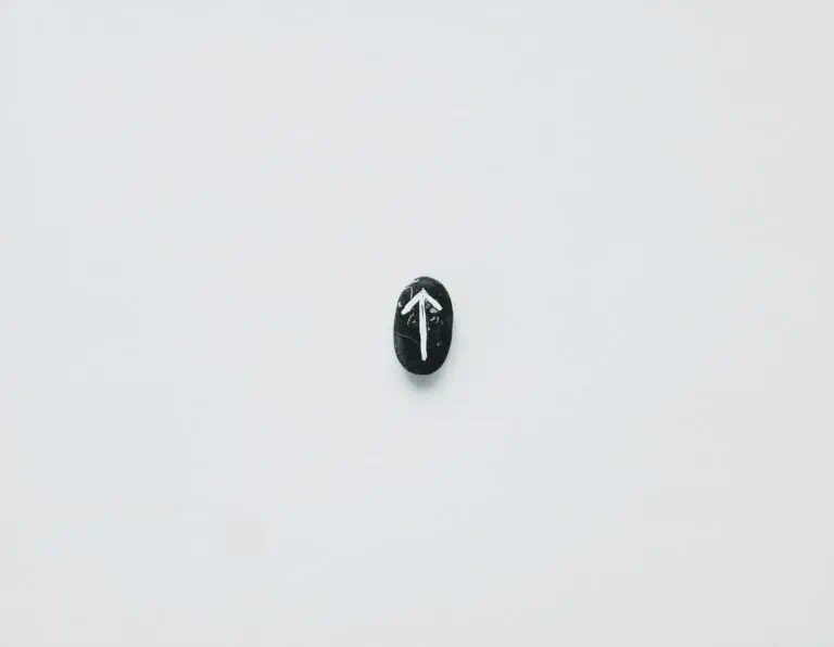 black rock with painted white arrow